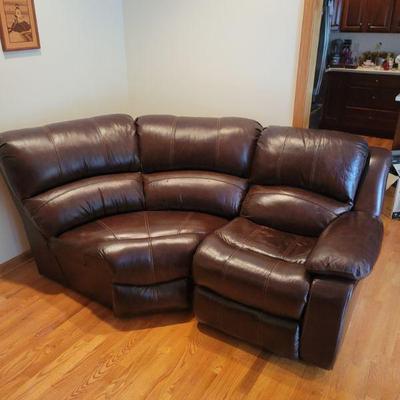 Espresso leather corner couch section.
$15