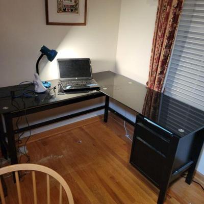 Modern Glass corner unit with storage cabinet.
56" long each side. 20" deep
$40