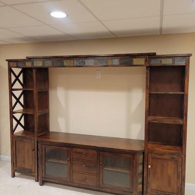 Modular entertainment center. 4 pieces for easy transport. 98" total width as is. Side pie es are 18" wide. Height is 74"
$45