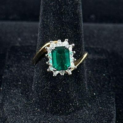 18K GOLD PLATED RING | Designed as an 18K gold plated ring with mounted stones, size 7.5, marked “18K H.G.E.”

