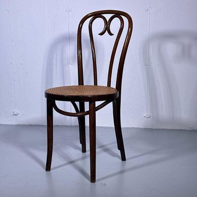 CURVED & CANED CHAIR | Cane chair with curved wood back. - h. 35 x dia. 16 in

