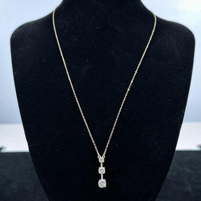 STERLING & DIAMOND SIMULANT NECKLACE | Designed as a gold-toned sterling silver necklace with silver pendant mounting 3 graduating...