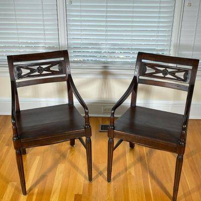 (2pc) PAIR WOOD ARMCHAIRS | Having carved back with spindle carved legs over H-stretcher. - h. 34 x w. 18 x l. 21.5 in

