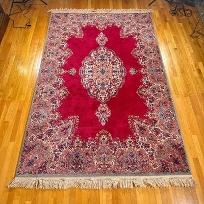 RED MEDALLION KARASTAN RUG | Karastan red medallion Kirman rug having red backing with large colorful central medallion and colorful...
