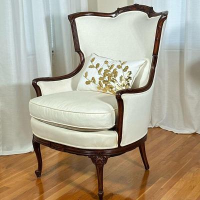 LOUIS XV STYLE BERGERE ARMCHAIR | Having carved back with floral relief carving over carved cabriole legs. - h. 43 x w. 28.5 x l. 32 in

