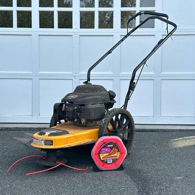 CUB CADET ST 100 WHEELED STRING TRIMMER | Cub Cadet ST 100 gas-powered 22” wheeled string trimmer with 159cc engine. - h. 42 x w. 19.5 x...