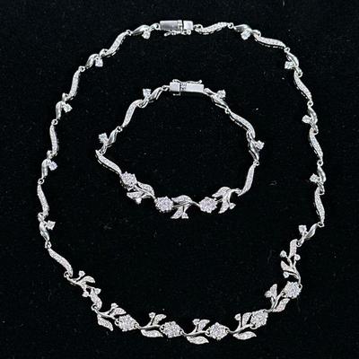 (2pc) STERLING NECKLACE & BRACELET SET | Designed as a sterling silver bracelet & with flower form links with mounted diamond...