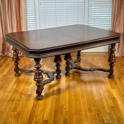 ANTIQUE CARVED WOOD DINING TABLE | Having carved wood refinished top over spindle carved & fluted legs, including 1 leaf. - h. 29 x...