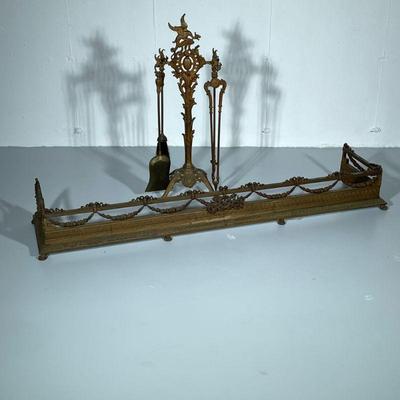FIREPLACE TOOLS & SKIRT | Including: bronzed cast iron fireplace skirt, and multiple fireplace tools. - h. 8 x w. 14 x l. 60 in

