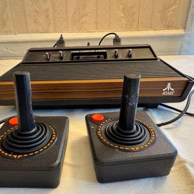 Atari Game Console With Cords And (2) Sets Of Controllers

