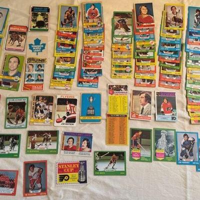 NHL Cards
Stanley cup 1972 1973 card in stack. Various player cards, coach cards, team cards for California Golden Seals, Buffalo Sabres,...