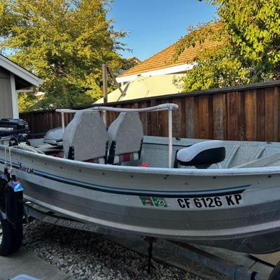 1991 Sylvan Yukon 12' fishing boat, with 15 hp/2 stroke Mercury, trailer, cover & near new Bimini top.  Trailer in great shape,...