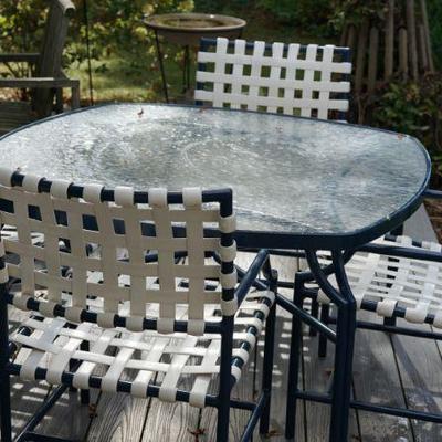 This perfect glass top patio table has been kept indoors in a sunroom, very comfortable 