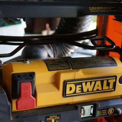 DeWalt sander. 
The garage looks like a hardware store of good selection. All tools and items for the tool shop. 