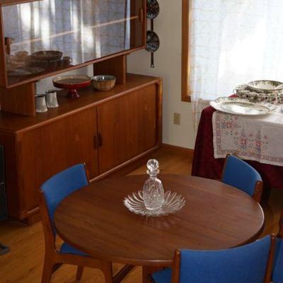 Dyrlund Denmark sideboard with glass top, sliding glass doors. Niels Bach round table and four chairs with leaf.