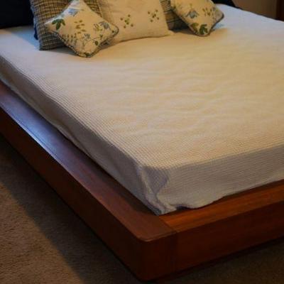Queen size platform bed. it does not have a headboard   four sided platform of good construction 