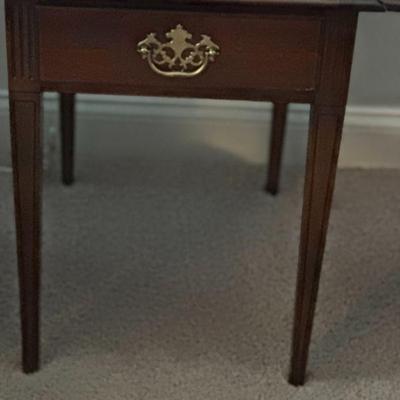 One of two matching end tables