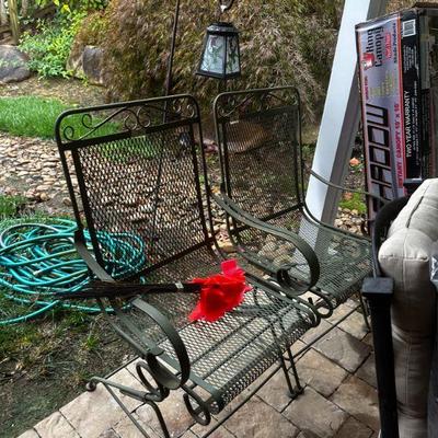 Two wrought iron rocker chairs
