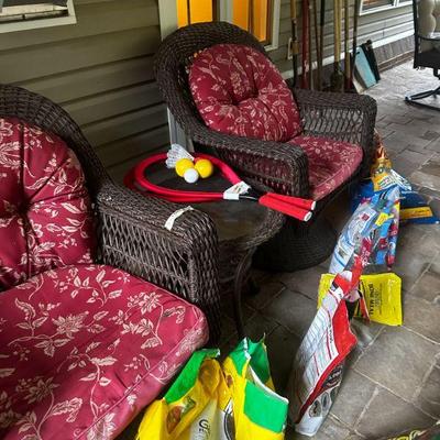 Two swivel rocking wicker chairs