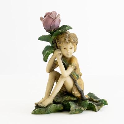 Boy Sitting & Hugging A Flower Porcelain Figurine