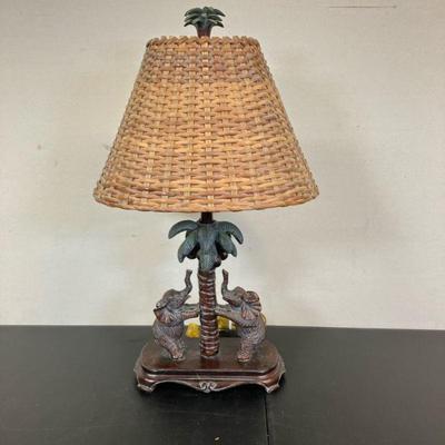 Elephant Lamp | Twin Elephants on Palm Tree, with rattan shade and palm finial. - h. 23” x w. 4.5” x l. 10” in (H to finial.)

