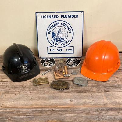 (12pc) Plumbing Traditions | Interesting Lot Includes: * Tin NY Plumber Sign * Three Plumber & Handyman Belt Buckles * White Plains...