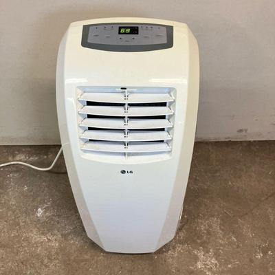 LG Portable Air Conditioner | Model # LR1013 WN. 10,000 BTU. With hose, window frame and remote. - h. 31” x w. 11” x l. 14.5” in