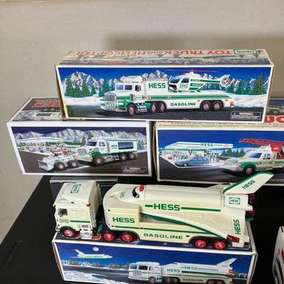 (15pc) Hess Trucks | Fifteen Hess Trucks. Nine mint in box. Four displayed and have box. Two no box. Years vary, earliest box date 1994...