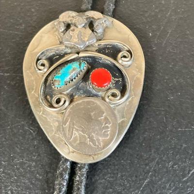 Southwestern Bolo Tie | The silver slide on the tie has a Big Horn Sheep, Buffalo Head nickel and Turquoise & Coral insets. - h. 2.5”...