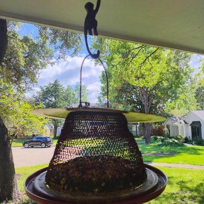 Bird feeder with monkey hook