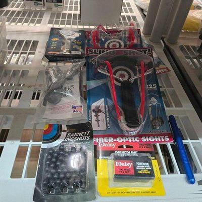 #5586 • (5) Slingshots, (2) Shingshot Ammo, and (1) Voodoo Tactical Pen
