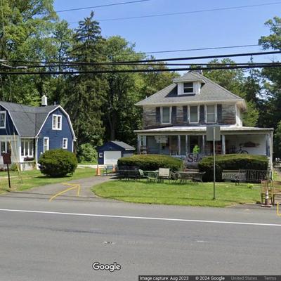 Please pull in the driveway immediately past the house, see yellow line. Parking is in the back.