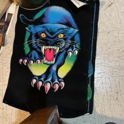 Retro glow-in-the-dark/black light velvet.