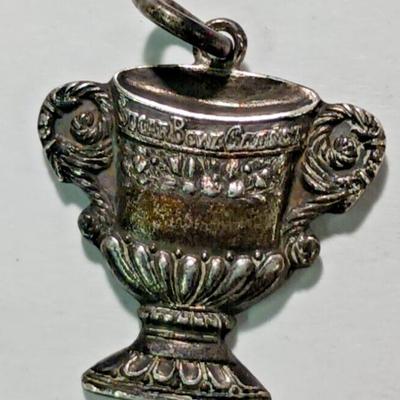 https://www.agesagoestatesales.com/product/sugar-bowl-classic-1939-football-game-vintage-sterling-silver-charm/1107