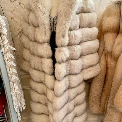 Full-length white fox coat by Shillito's Fur Salon