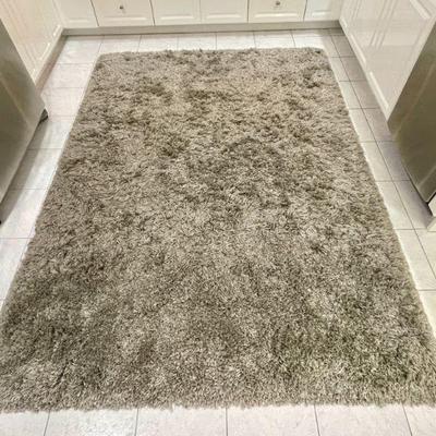 Machine-made thick shag rug, measures 5'6 x 5'9