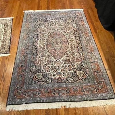Hand-knotted silk "Kashan" area rug, measures 6'9 x 4'6