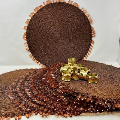  Exotic Decor Lot -Eight Round Beaded Placemats, & Ten Brass Napkin Rings