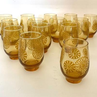 Set of 14 Libbey amber tumblers in raised daisy pattern
