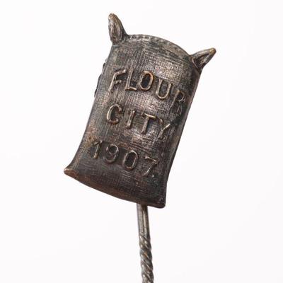 1907 Flour City Ornamental Iron works pin given out at the grand opening in MINN.
