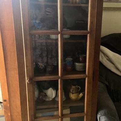 Vintage tea and wine sets inside this beautiful cabinet 