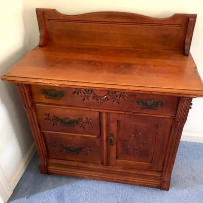Carved antique commode