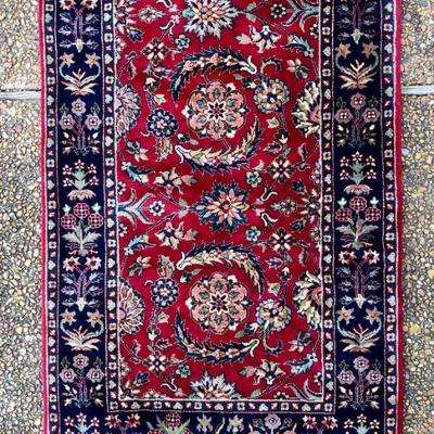 Red and navy Persian rug