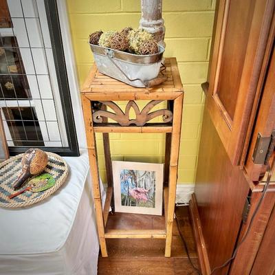 Second of two rattan plant stands