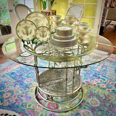 Glass dining table with metal base