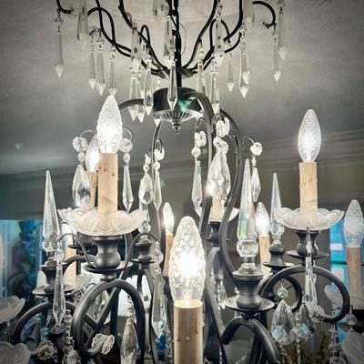 All light fixtures are for sale. One of two chandeliers. This one is located in the Dining Room.