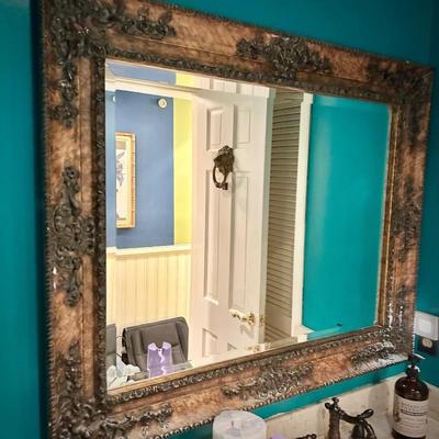 Wall mirror in bathroom