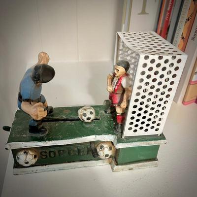 Vintage cast iron soccer mechanical coin bank