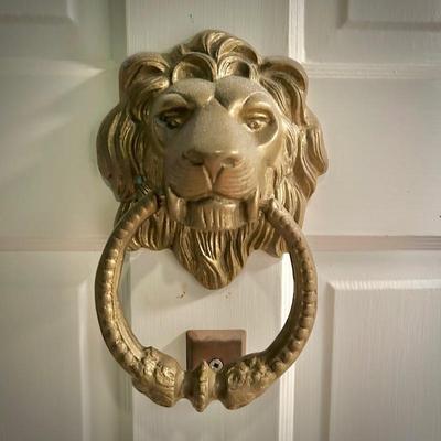 Brass lion door knocker