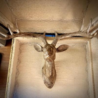 Vintage steamer trunk with wood deer head